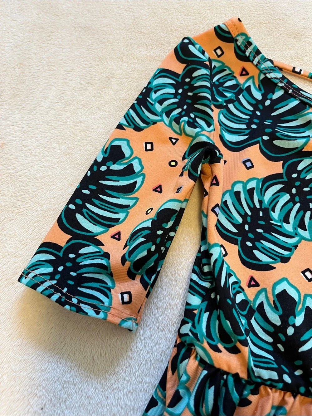 Dot Dot Smile | Little Girls Peach Monstera Leaf Dress 3/4